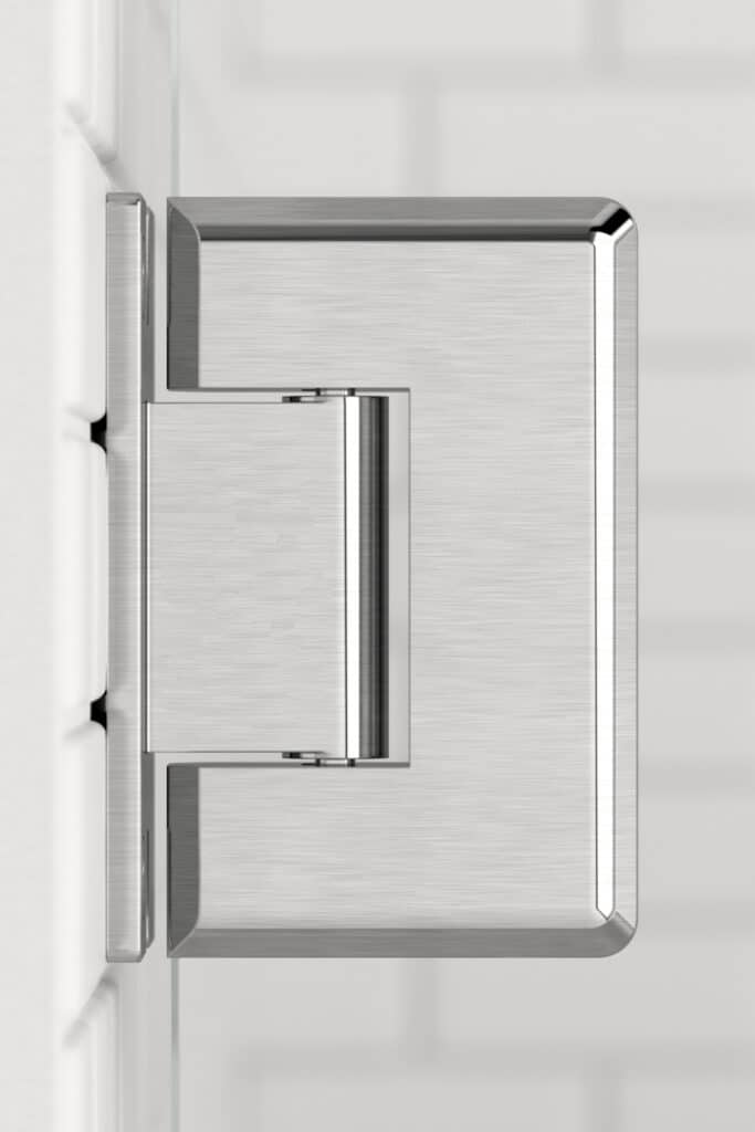 Stainless steel door handle on a white shower door.